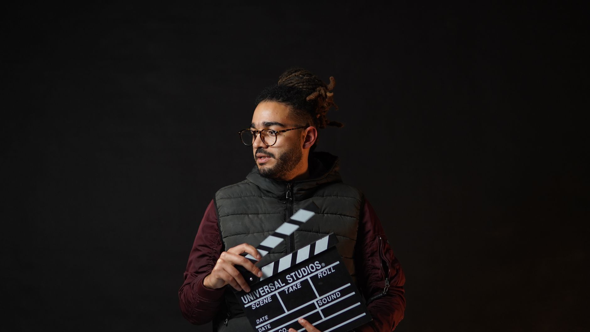 Filmmaker holding a clapperboard